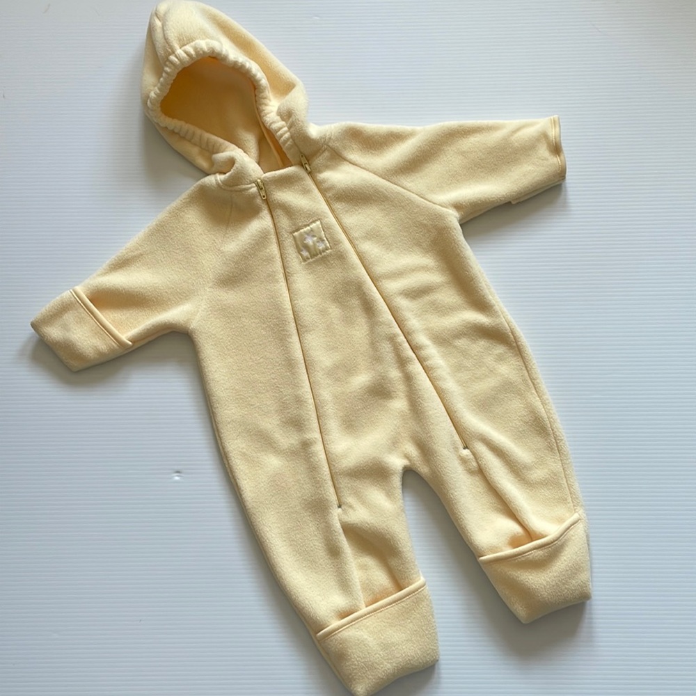 One piece light yellow snowsuit with attached hood. Size 3-6 months.